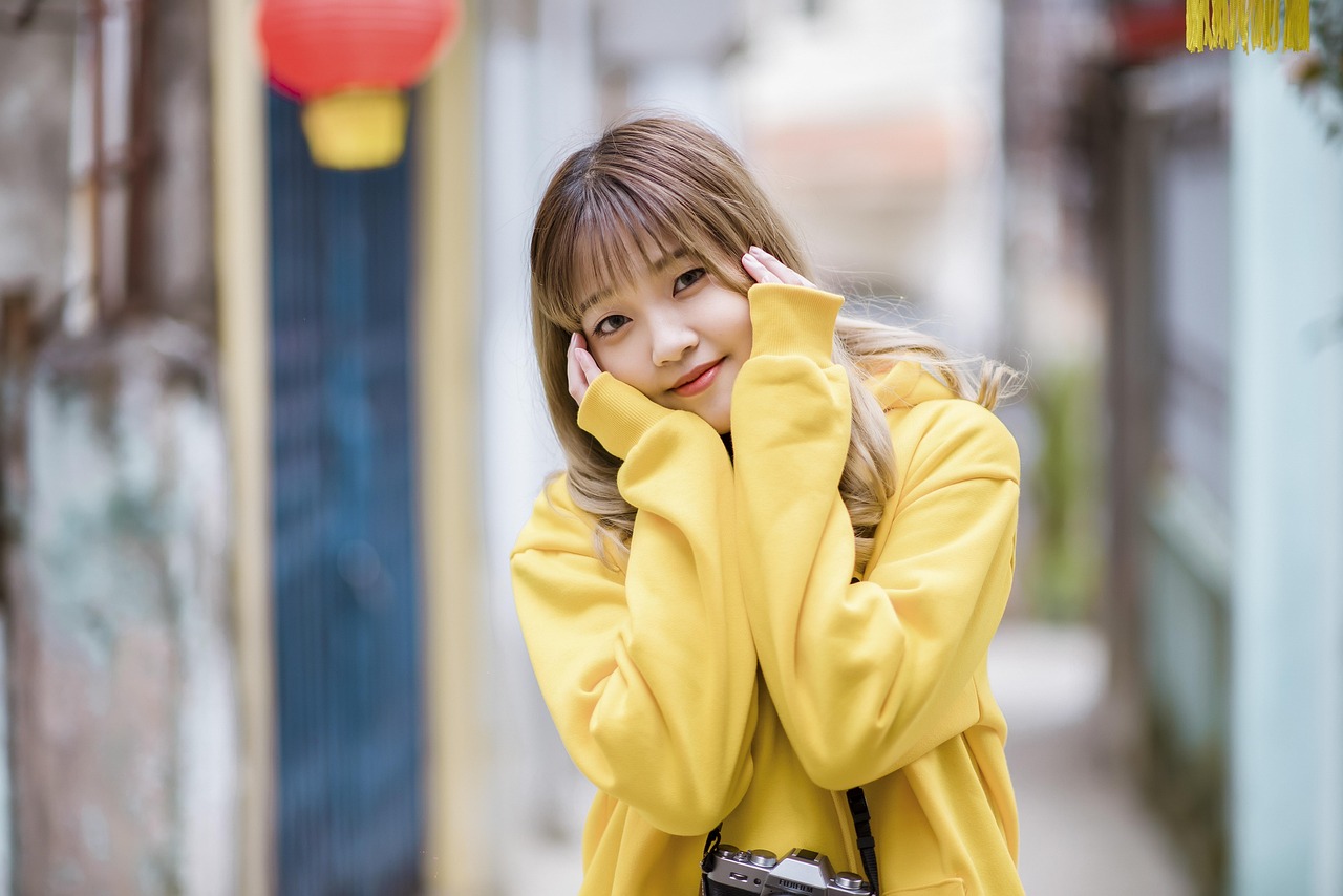 Woman in a yellow hoodie